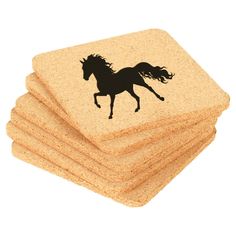 four cork coasters with a black horse on them