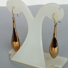 ❀✿❀A PAIR of long teardrop bauble. This is a sterling silver earring dipped in gold.Size: Length: 5.3cm  Width at widest section: 11 x 13 mm Weight: 7.25 gmDrop length: 6.4 cmThese earrings are made of real 925 hypoallergenic sterling silver, dipped in real gold.Can be packaged in a gift box.I can write out a message from you to the receiver if needed.Please be free to contact me at...   bhavnakwintra1956@gmail.comMore hoops: https://www.etsy.com/your/shops/TheSilverGame/tools/listings/section:2 Minimalist Earrings Gold, Dangler Earrings, Evil Eye Earrings, Thread Earrings, Eye Earrings, Bohemian Earrings, Big Earrings, Silver Earring, Earrings Sterling Silver