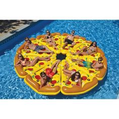 an inflatable pizza floating on top of a pool with people laying around it