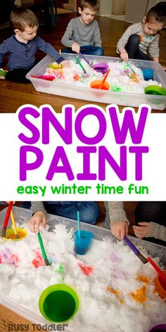 three children are playing with snow paint in a play tray and on the floor is an easy winter time fun activity for toddlers