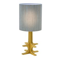 a gold table lamp with a white shade