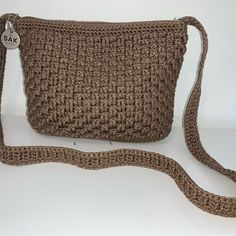 Gorgeous Crocheted Crossbody Bag By The Sak. New Condition- Tags Were Removed But Bag Was Never Used. Beautiful Taupe Color. One Exterior Zipper Pocket; Interior Zipper Pocket, Cell Phone Pocket And 2 Bonus Pockets. Zipper Closure. Measurements Are 8” High By 10” Wide. This Bag Is A Must Have And Will Be Your Go To Bag For All Of Your Outfits! Adjustable Strap Crochet Crossbody Bag, Crochet Crossbody Bag With Adjustable Strap, Daily Use Crochet Crossbody Bag, Everyday Use Crochet Crossbody Bag, Brown Crochet Shoulder Bag For On-the-go, Chic Crochet Crossbody Mobile Phone Bag, Brown Crossbody Crochet Bag With Adjustable Strap, Brown Crochet Crossbody Bag With Adjustable Strap, The Sak