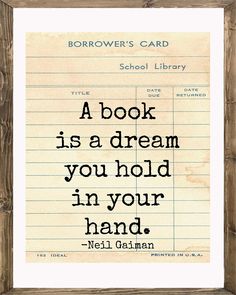 a book is a dream you hold in your hand by neil gaiman quote on lined paper