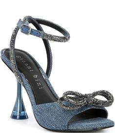 From Gianni Bini&#x2C; the Haydn Denim Rhinestone Bow Ankle Strap Dress Heels feature:Denim fabric upperRhinestone detail on straps and bowAnkle strap with buckle closureSynthetic lining4mm padded memory foam sockSynthetic outsoleApprox. 3.94" heel heightImported. Denim Ankle Strap Heels For Parties, Denim Heels With Ankle Strap For Party, Chic Party Denim Heels, Summer Evening Denim Heels, Homecoming Heels, Denim Heels, Womens Summer Shoes, Rhinestone Heels, Gianni Bini