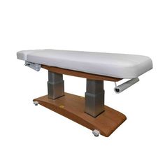 Elevate Your Spa ExperienceIndulge in the ultimate blend of luxury and functionality with the Woody Pedestal 2259+ Electric Massage and Spa Table by Silver Fox, meticulously designed for high-end spas, medical esthetics, and massage therapy centers.Crafted for those who prioritize both aesthetics and stability, this spa table stands out with its robust dual pedestal base. The added strength of this design ensures that the table stays unwavering, even during intensive treatments where firm pressu Adjustable Spa Bed, Medical Esthetics, Spa Table, Spa Bed, Spa Luxe, Spa Interior, Table Sizes, Silver Fox, Massage Therapy