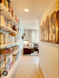 a living room filled with lots of books