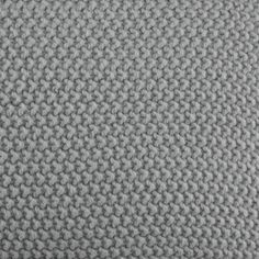 an up close shot of a gray knitted material