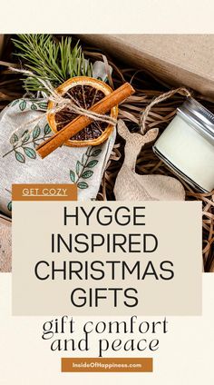 an open gift box with cinnamons, orange slices and spices in it that says hygge inspired christmas gifts