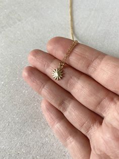 "This solid 14k gold charm is stunning and has a great detail. The slightly curved sun beams and its dome shape add dimension. The pendant measures approximately 8 mm. Now available with the 16 or 18\" dainty solid 14k gold chain. The sun will be suspended on 4 mm open bail (see 1st photo) If you only purchasing the charm, select bail size: 4 mm 14k open jump ring bail and can accommodate chains up to 1.6 mm. 6 mm 14k closed bail that can suit thicker necklaces. Hallmarked 14K 14k sand dollar ch Sand Dollar Pendant, Thick Necklace, Solid Gold Charms, White Opal Ring, Sun Pendant, Gold Filled Ring, Celestial Jewelry, Minimal Jewelry, Sterling Silver Bands