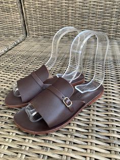 FREE AUSTRALIA WIDE SHIPPING. 100% leather, handmade slide sandal with silicon padding, for comfort. Thick band slide, with metal buckle. Chocolate brown leather. Summer Beach Sandals With Brass Buckle, Leather Footbed Sandals With Tang Buckle For Beach, Leather Slide Sandals With Leather Sole, Adjustable Leather Slip-on Slippers, Leather Beach Slippers With Buckle Closure, Beach Sandals With Tang Buckle And Slide Shape, Beach Slide Sandals With Tang Buckle, Open Toe Slides With Tang Buckle For Beach, Leather Slide Mules With Tang Buckle