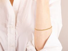 Introducing our elegant Gold Chain Layering Bracelet--a minimalistic piece for sophistication. This dainty 14k solid gold bracelet wraps gracefully, ensuring durability and lasting shine. Perfect for layering, it allows you to create a unique style. The charming gold ball adds allure, making it suitable for everyday wear or special occasions. Whether for yourself or as a thoughtful gift, embrace its delicate and timeless beauty. Details        - Gold KT: 14K Solid Gold        - Gold Color: Yellow Gold        - Bracelet Length (Inches): 6-8"        - Chain style: Beaded        - Gauge: 3.01mm        - 100% Waterproof and Sweat Proof Shipping  ⁃Ships within 1-2 Business Days ⁃FREE shipping on all U.S. orders via USPS First Class Mail With tracking number ⁃Insurance included on orders over $1 Chain Layering, Solid Gold Bracelet, Ball Bracelet, Layered Bracelets, Yellow Gold Bracelet, Sweat Proof, Bracelet Gold, Jewelry Gift Box, Gold Gold