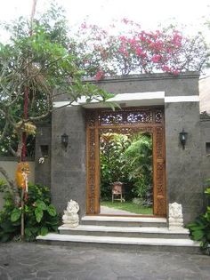 an entrance to a house with steps leading up to it