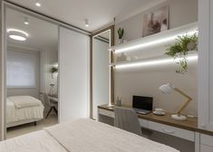 a bedroom with a bed, desk and shelves on the wall in front of it