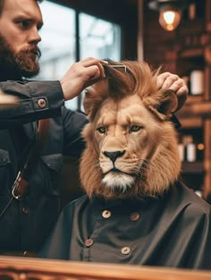 a man cutting the mane of a lion's head at a barbershop