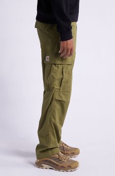 Multiple pockets bring plenty of storage to cargo pants cut from durable cotton ripstop with a classic flat front and adjustable drawstring hems. 17" leg opening; 12" front rise; 15 1/2" back rise Zip fly with button closure Front slant pockets; back flap-patch pockets Drawstring hem 100% cotton Machine wash, tumble dry Imported Carhartt Work In Progress, Work In Progress, Cargo Pants, Patch Pocket, Nordstrom, Gift Ideas, Bring It On, Outfit Inspo, Pants