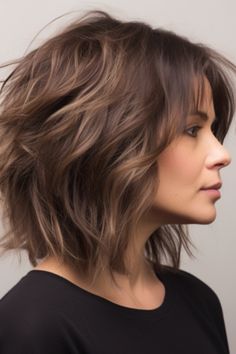 The tousled medium-length shag cut is perfect if you want to achieve an edgy and contemporary look. The layered cuts provide texture and volume making it ideal for those with hair. Click here to check out more flattering medium-length haircuts for women over 40. Haircuts For Women Over 40, Layered Haircuts For Medium Hair, Edgy Haircuts, Shoulder Length Hair Cuts, Haircuts For Women, Medium Hair Cuts, Shoulder Length Hair