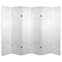 a white room divider with four panels