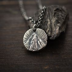 Handmade Sterling Silver 925 Mountain necklace. Perfect for mountain and nature lovers.  The silver necklace was oxidized to create more antique rustic look. It is a unisex necklace so it fits both men and women. ❤  Every piece is a unique artwork carefully crafted  by my own hands. Because of this, every piece is unique. So there might be slight variations in shape or color. You can choose different Silver chain length for this pendant or if you like you can choose Adjustable black cotton cord Nature-inspired Oxidized Pendant Necklace, Handmade Spiritual Necklaces For Outdoor, Silver Pendant Necklace For Outdoor, Rustic Oxidized Finish Pendant Jewelry, Handmade Rustic Jewelry For Outdoor, Rustic Oxidized Pendant Necklace, Outdoor Handmade Pendant Jewelry, Rustic Sterling Silver Engraved Necklaces, Rustic Engraved Sterling Silver Jewelry