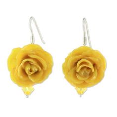 Thailand's Danai presents this tempting pair of dangle earrings. Local artisans craft them dyeing two petite natural roses with an eye-catching yellow color and preserving them in shining resin. Accented with complementary glass beads the roses adorn the ears on hooks of sterling silver. Affordable Handmade Yellow Flower Earrings, Yellow Hypoallergenic Flower Drop Earrings, Elegant Yellow Dangle Flower Earrings, Elegant Yellow Flower-shaped Earrings, Yellow Flower-shaped Earrings, Resin Coating, Premium Gift, Local Artisans, Rose Earrings