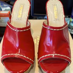 Euc. Prada Patent Red Leather Size 39 Cork Wedge With 4.5” Heel And 1.5” Platform. One Minor Scuff On Outer Right Shoe At Bottom. (See Pic) Red Round Toe Wedge Sandals For Formal Occasions, Red High Heel Wedge Sandals For Formal Occasions, Chic Red Wedge Sandals For Formal Occasions, Chic Red Formal Wedge Sandals, Formal Red High Heel Wedge Sandals, Patent Leather Platform Wedge Heels, Designer Wedge Heels With Red Sole, Designer Red Platform Sandals, Red Prada Shoes