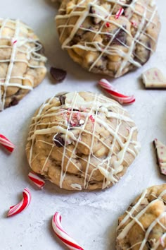 cookies with white chocolate drizzle and candy canes on the side, ready to be eaten