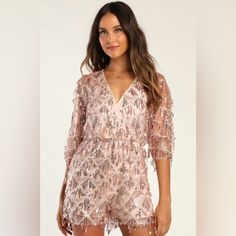 Nwt Lulu’s Xs Rose Gold Romper The Lulus Sweet Sparkles Rose Gold Sequin Fringe Embroidered Romper Is Glamorous And Fun, All Wrapped Up In One Pretty Package! Fringe-Y Strands Of Rose Gold Sequins And A Subtle Embroidered Diamond Pattern Accent Sheer Mesh As It Shapes This Cute Romper With A Surplice Neckline And Dolman-Style Half Sleeves. A Blousy Bodice Tops An Elasticized Waist And Loose-Fitting Shorts. Keyhole Opening And Button Closure At Back. Lined. Shell: 100% Polyester. Lining: 100% Pol Elegant Embroidered Jumpsuits And Rompers For Party, Pink Sequined Jumpsuits And Rompers For Summer, Fitted Jumpsuits And Rompers For Festive Summer, Fitted Jumpsuits And Rompers For Summer Festivals, Summer Festive Sequined Jumpsuits And Rompers, Embroidered Jumpsuits And Rompers For Summer Parties, White Long Sleeve Romper, Gold Romper, Black Halter Jumpsuit