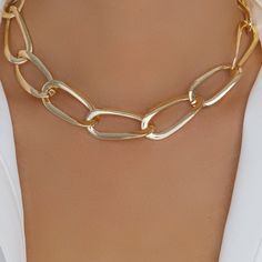 Material: gold plated brass Length: 16" IMPORTED Gold Link Metal Choker, Gold Metal Necklaces With Adjustable Chain, Gold Metal Necklace With Adjustable Chain, Gold Necklace With Adjustable Chain, Gold Chunky Chain Link Choker, Gold Metal Chain Choker Necklace, Gold-tone Link Necklaces, Gold Chain Link Metal Choker, Gold Clavicle Chain Link Necklace