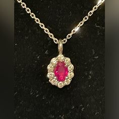 Beautiful Oval Ruby And Diamond Pendant Set In 14k White Gold . The Ruby Is Surrounded By Ten Small Round Natural Diamonds That Sparkle. The Ruby Is Almost A Half Carat (.48) , Then Ten Small Diamonds Are Approximately A Quarter Carat(.25) . The 14k White Gold 15.5 Inch Chain Is Included . Chain Was Shortened By Half Inch. The Pendant Including Bail Is Approximately 13.3mm . Please Refer To Pictures As They Are Also Part Of The Description. Diamond Pendant Set, Diamond Pendant Sets, Ruby Pendant, Pendant Set, Diamond Pendant, Womens Jewelry Necklace, Natural Diamonds, Gold Color, Ruby