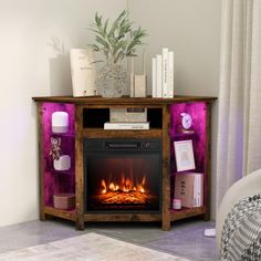 a living room with a fire place in the center and books on top of it