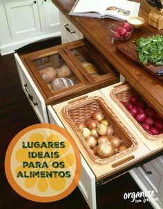 an open drawer in the middle of a kitchen counter with vegetables and other items on it