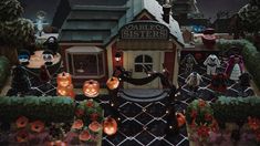 an animated halloween scene with pumpkins, jack - o'- lanterns and other decorations