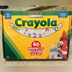 an unopened box of crayola sits on the floor