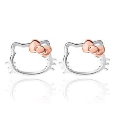 Experience the timeless elegance of Hello Kitty with these simply cute and beautifully crafted stud earrings. These silver earrings feature an understated design of a Hello Kitty silhouette, adorned with a dusty pink rose gold bow that adds a pop of color and charm. Crafted from durable 925 sterling silver, these Hello Kitty earrings are made to last and retain their shine for years to come. They feature a post back butterfly closure, ensuring a secure and comfortable fit. Hello Kitty Silhouette, Hello Kitty Stud Earrings, Kitty Silhouette, Hello Kitty Earrings, Hello Kitty Jewelry, Kitty Accessories, Glass Jewelry Box, Hello Kitty Accessories, Front Back Earrings