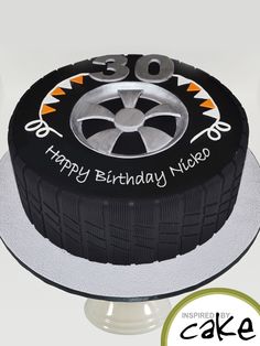 a birthday cake with an image of a tire on it