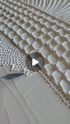 a close up view of a mattress with a knife stuck in the middle of it