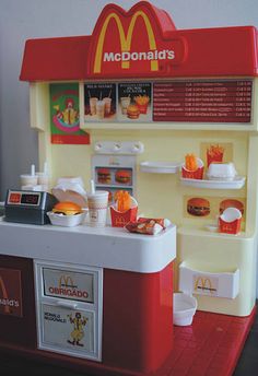 a toy mcdonald's hot dog stand is shown