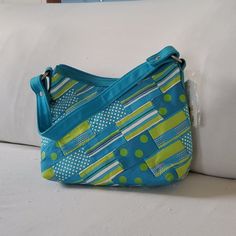 Turquoise And Lime Green 11x7 Canvas Bag With Shoulder Strap. Retro Green Everyday Bag, Green Retro Everyday Bag, Retro Green Bag With Removable Pouch, Retro Green Tote Shoulder Bag, Blue Casual Hobo Bag With Double Handle, Casual Blue Hobo Bag With Double Handle, Blue Rectangular Canvas Bag With Zipper Closure, Blue Canvas Tote Bag With Zipper, Blue Canvas Tote Bag With Zipper Closure