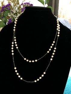 "This piece was designed to copy an actual necklace worn by Lady Mary in the PBS series Downton Abbey. This necklace is 50\" of tiny glittering faceted gold natural iron pyrite beads interspersed with mint condition 6mm vintage cream colored pearls with a fantastic creamy pink luster OR genuine AAA freshwater pearls (choose when you checkout). This is a VERY long necklace; it measures 50\" total from top to bottom. It can be worn as one long necklace (if you're tall or channeling your inner flap Elegant Pearl Beaded Long Necklace, Elegant Pearl Long Necklace With Beads, Elegant Multi-strand Pearl Necklace With Faceted Beads, Classic Beaded Pearl Necklace For Evening, Elegant Double Strand Pearl Necklace With Beaded Chain, Formal Long Beaded Necklaces With Pearl Chain, Formal Double Strand Long Necklace, Elegant Double Strand Long Necklace For Formal Occasions, Elegant Faceted Beads Jewelry For Evening