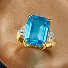 Ross-Simons - 13.00ct Swiss Blue Topaz Ring, .13ct t. w. Diamonds in 18kt Yellow Gold. Size 9. Every eye will be on you when you don this incredible ring. An absolutely stunning 13.00 carat emerald-cut Swiss blue topaz is sided by the sparkle of .13 ct. t. w. round brilliant-cut diamonds. Luxuriously crafted in 18kt yellow gold. 5/8" wide. Diamond and Swiss blue topaz ring. Blue Topaz birthstones are the perfect gift for December birthdays. Luxury Blue Topaz Ring With Diamond Accents, Luxury Yellow Gold Topaz Ring With Diamond Accents, Elegant Diamond Topaz Ring With Pave Setting, Formal Diamond Pave Set Topaz Ring, Formal Topaz Ring With Pave Diamond Setting, Formal Topaz Ring With Diamond Pave Setting, Classic Yellow Gold Topaz Ring With Gemstone Accents, Elegant Topaz Ring With Pave Setting For Formal Occasions, Fine Jewelry Yellow Gold Topaz Ring With Diamond Accents