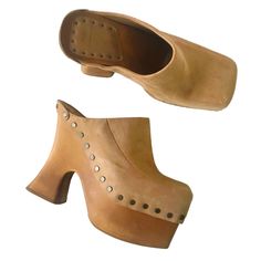 Ugg X Eckhaus Latta El Boogie Genuine Suede Leather Clog Mule Platforms With Square Toes, Chunky Heels, And Stud Nail Head Around. Tan Brown. Womens Size 9. Barely Used, Some Scuffs / Marks On The Wood And Leather. Brown Leather Clogs With Padded Heel, Beige Leather Platform Mules, Chic Brown Clogs With Sculpted Heel, Brown High Heel Clogs With Sculpted Heel, Brown Clogs With Sculpted Heel For Spring, Spring Brown Clogs With Sculpted Heel, Clog Mules, Mules Heels, Leather Clog