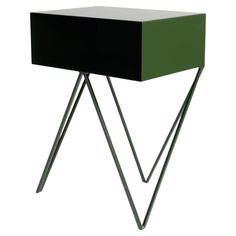 a black and green side table with two metal legs on the bottom one has a white top