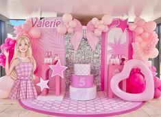 a barbie doll themed birthday party with balloons, cake and pink decor for the entrance