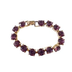 This vintage women's tennis bracelet showcases a 14+ carat purple amethyst gemstone, which has been lab-created and is perfectly round in shape. The gemstone is set in a gold tone metal with slight signs of wear, stone with minor loss,, but is still in overall good condition. Measuring 6.75 inches in length and 0.25 inches in height. Gold Amethyst Bracelets For Formal Occasions, Elegant Purple Tennis Bracelet, Elegant Purple Cubic Zirconia Bracelets, Elegant Purple Amethyst Tennis Bracelet, Elegant Round Amethyst Crystal Bracelet, Elegant Amethyst Bracelet, Purple Jubilee Tennis Bracelet, Classic Amethyst Bracelets In Purple, Classic Purple Tennis Bracelet As A Gift