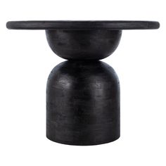 a black vase sitting on top of a white surface with a circular base in the middle