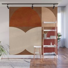 an orange and beige wall mural in a living room