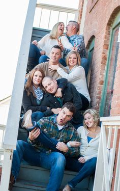 a group of people that are sitting on some stairs