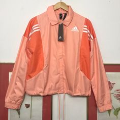 New With Tags Lightweight Adidas Coach Track Jacket, Size Medium. - Snap Front, Drawstring At Waist - Pink / Salmon Main With Three Stripes And Logo In White - Polyester - Machine Wash White Track Jacket For Outdoor, Adidas Spring Sportswear Windbreaker, Adidas Zip Up, Adidas Windbreaker, Adidas Jackets, Adidas Running, Running Jacket, Red Adidas, Pink Adidas