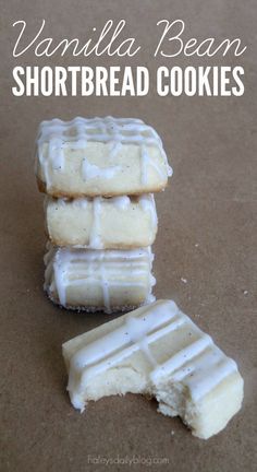 vanilla bean shortbread cookies with white frosting on top and one cut in half