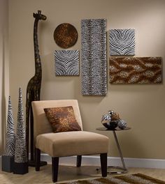 a giraffe is standing next to a chair in a room with zebra prints on the walls