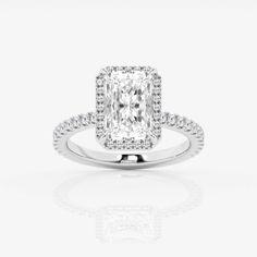 an engagement ring with a cushion cut diamond in the center and pave set shoulders